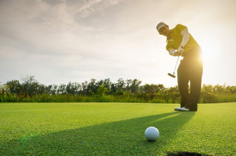 Man playin golf.
