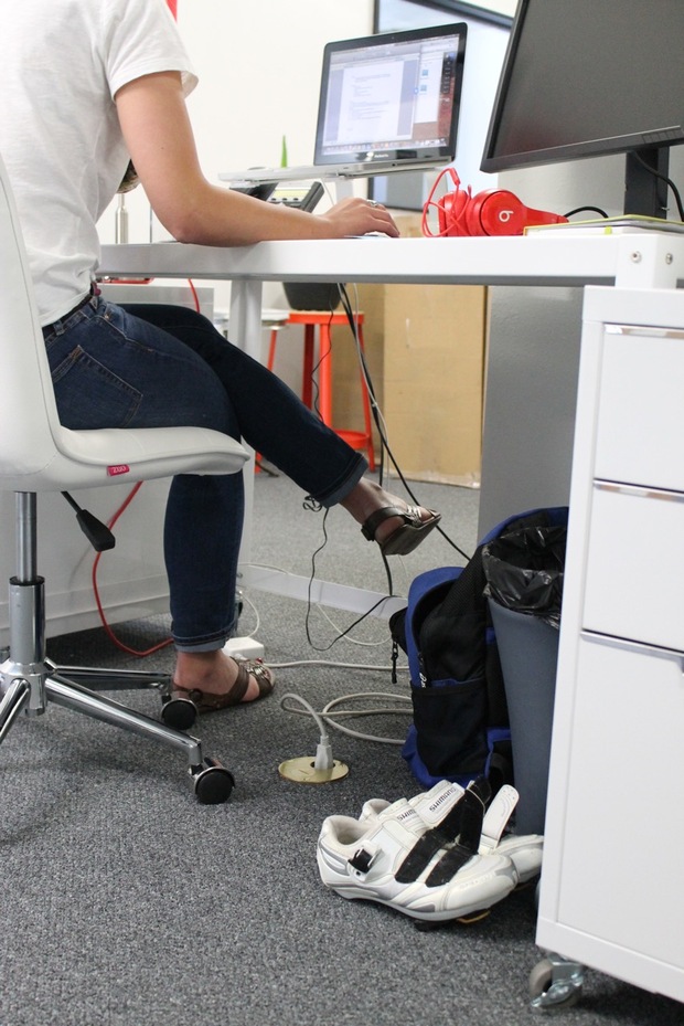 Bicycling shoes beneath a PeopleForBikes desk Bicycling shoes beneath a PeopleForBikes desk