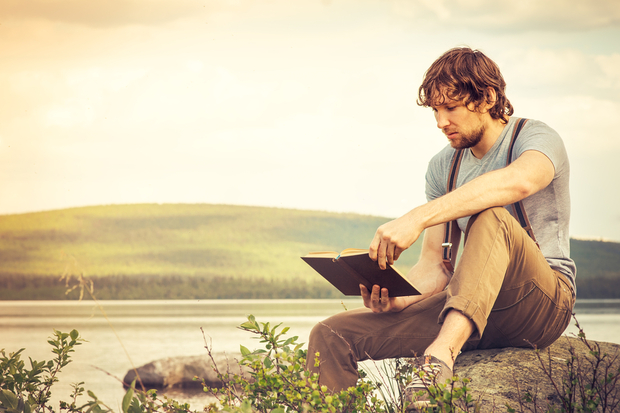 Man reading a life-changing book
