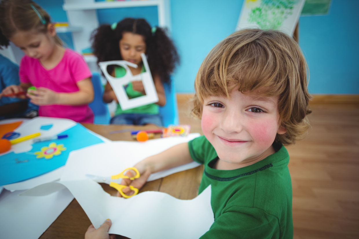 A happy child doing arts and crafts A happy child doing arts and crafts