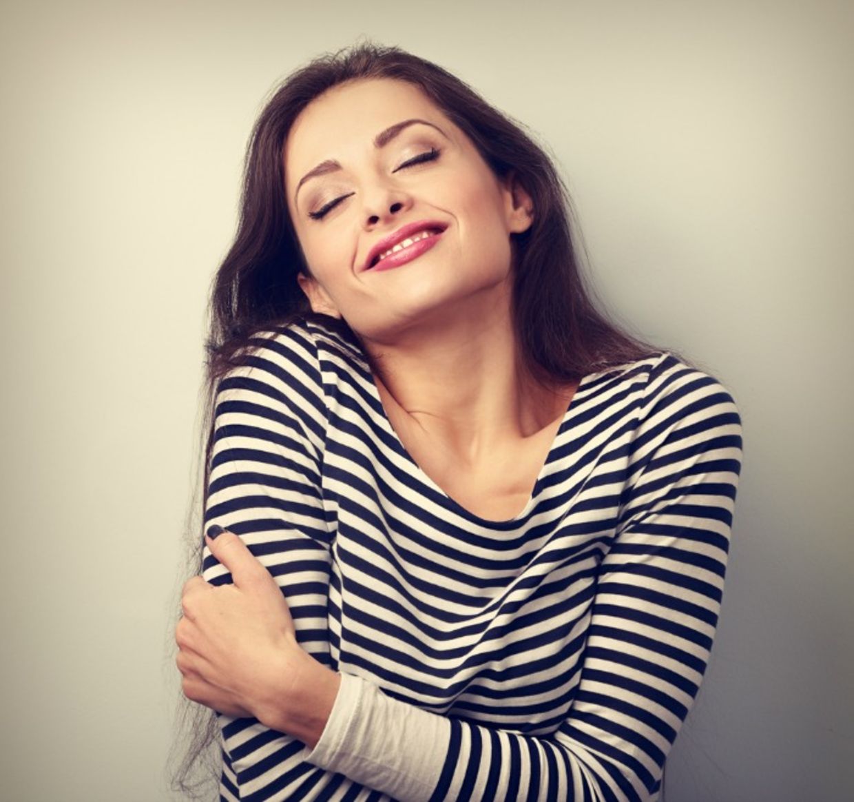 Woman hugging herself