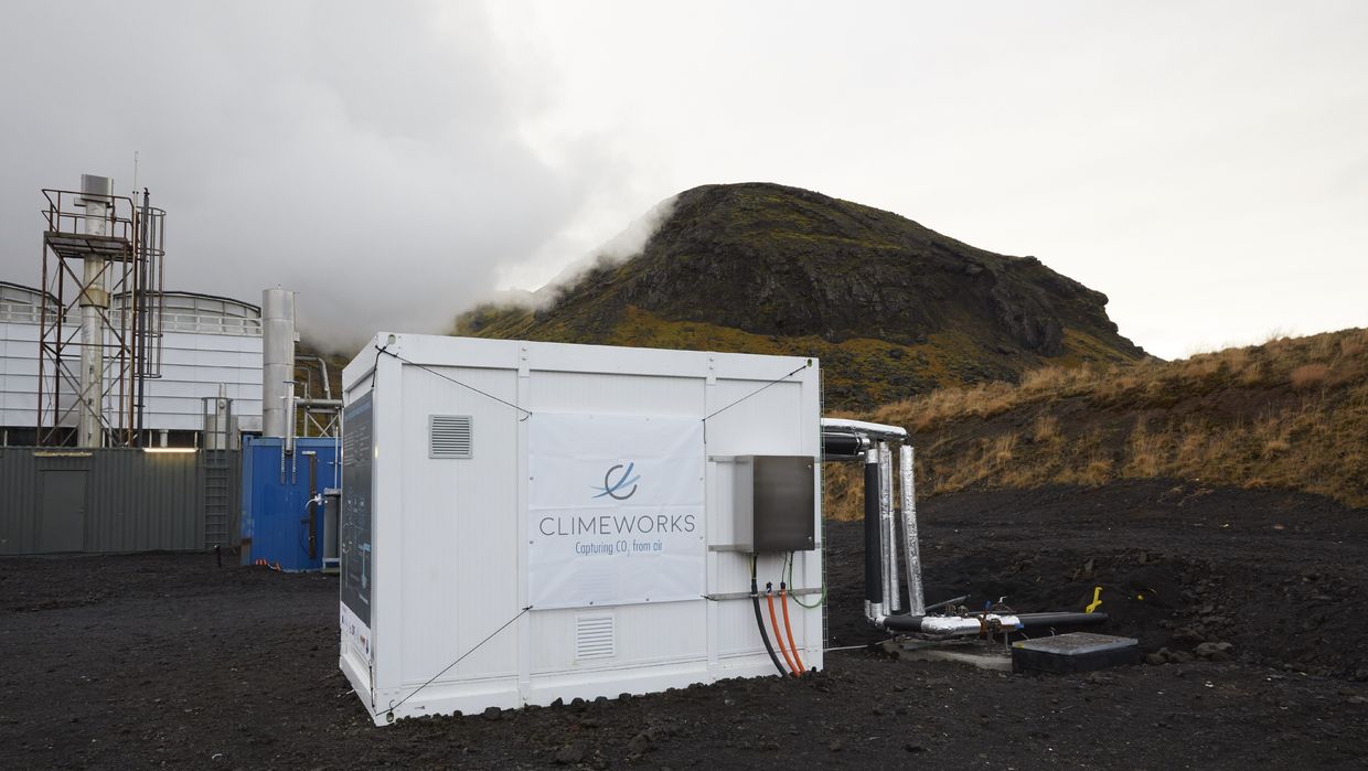Direct air capture unit along with the cooling towers of the geothermal power plant in Hellisheidi, Iceland. Direct air capture unit along with the cooling towers of the geothermal power plant in Hellisheidi, Iceland.