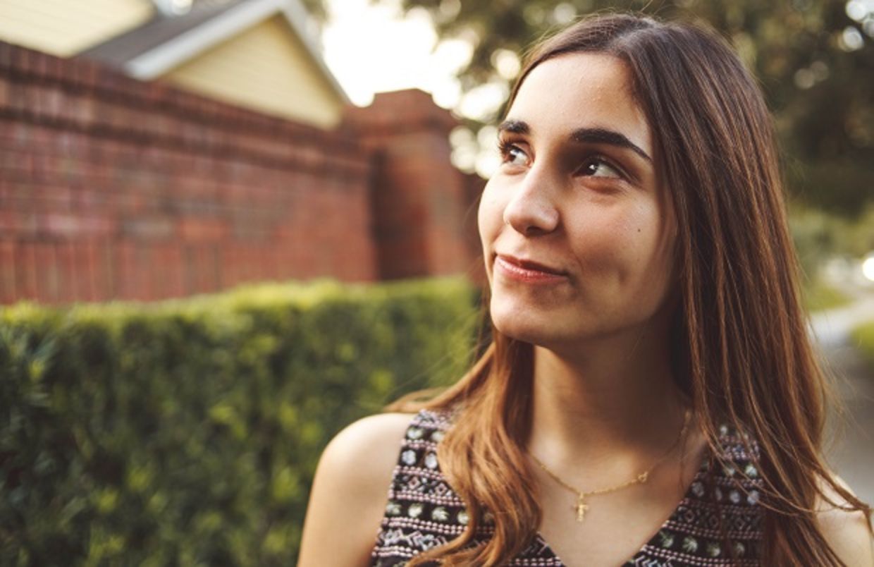 Young woman looking optimistically into the distance
