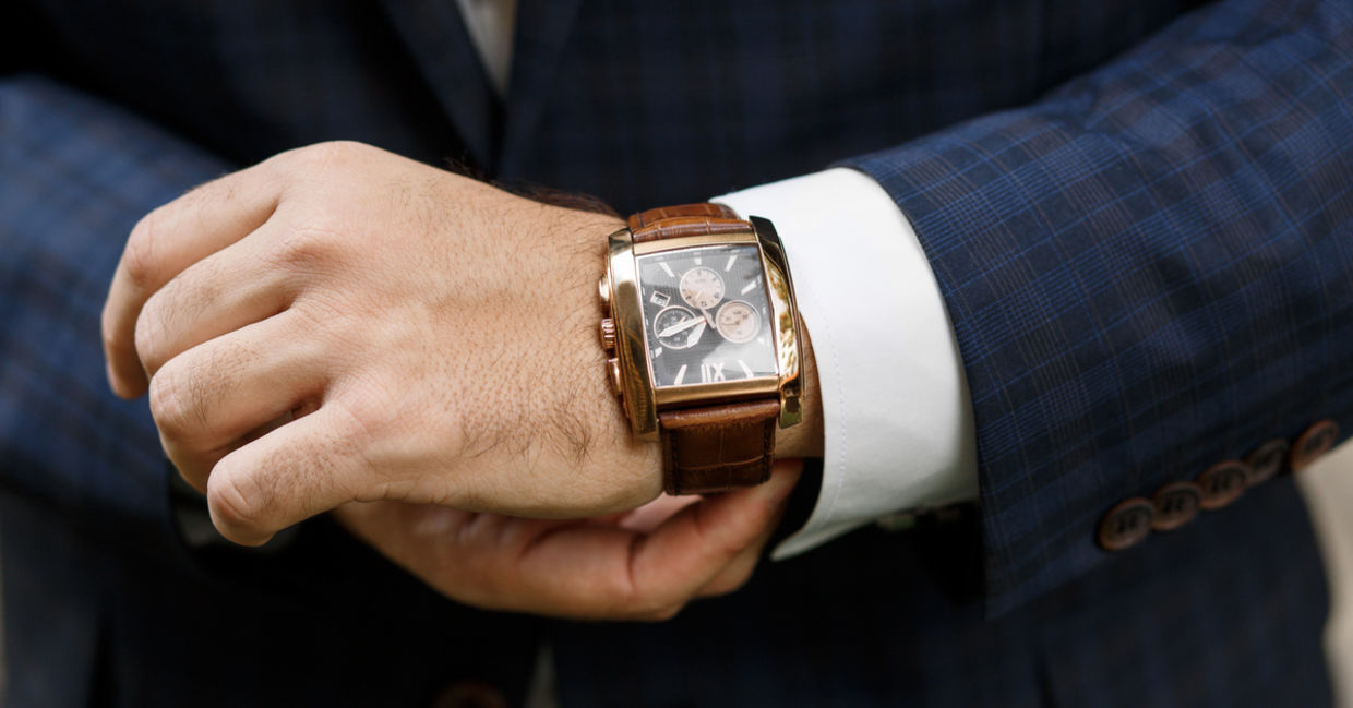 A closeup of designer watch on a businessman's hand A closeup of designer watch on a businessman's hand