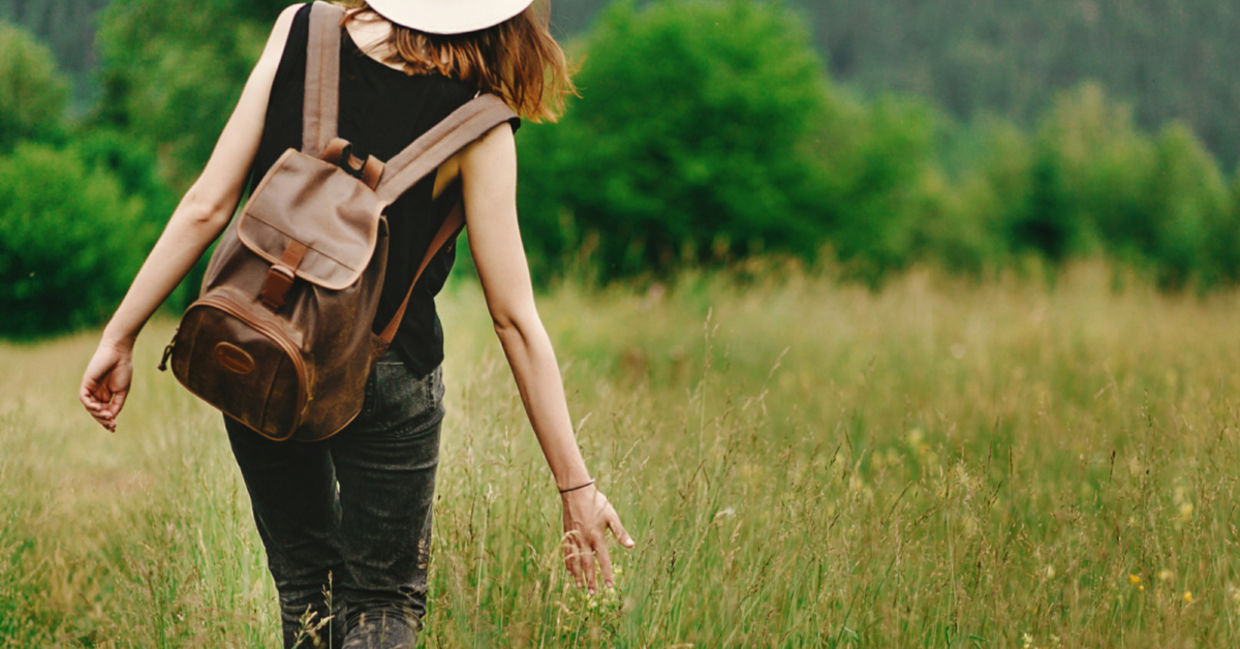 Woman walking outdoors to show intrinsic motivation Woman walking outdoors to show intrinsic motivation