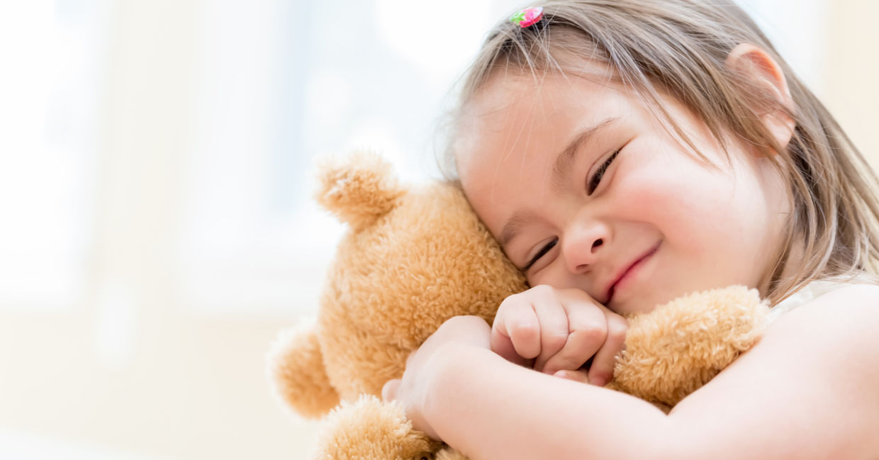 little girl hugging a teddy bear little girl hugging a teddy bear