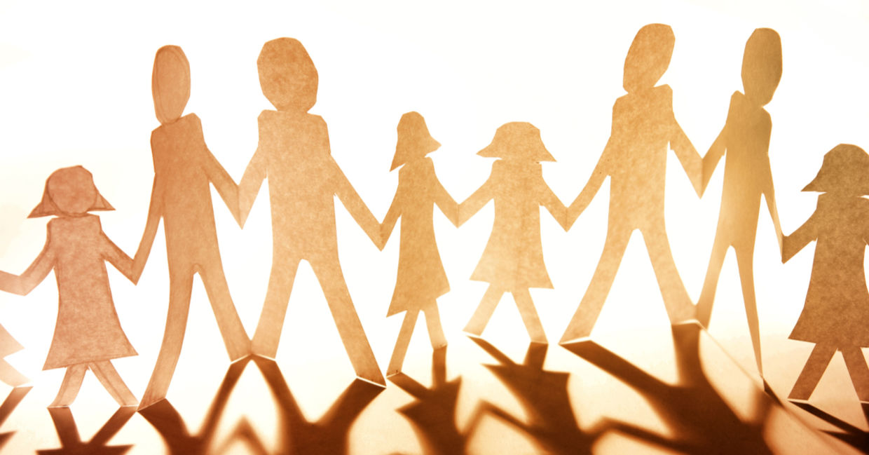 Paper cutouts of family and community Paper cutouts of family and community