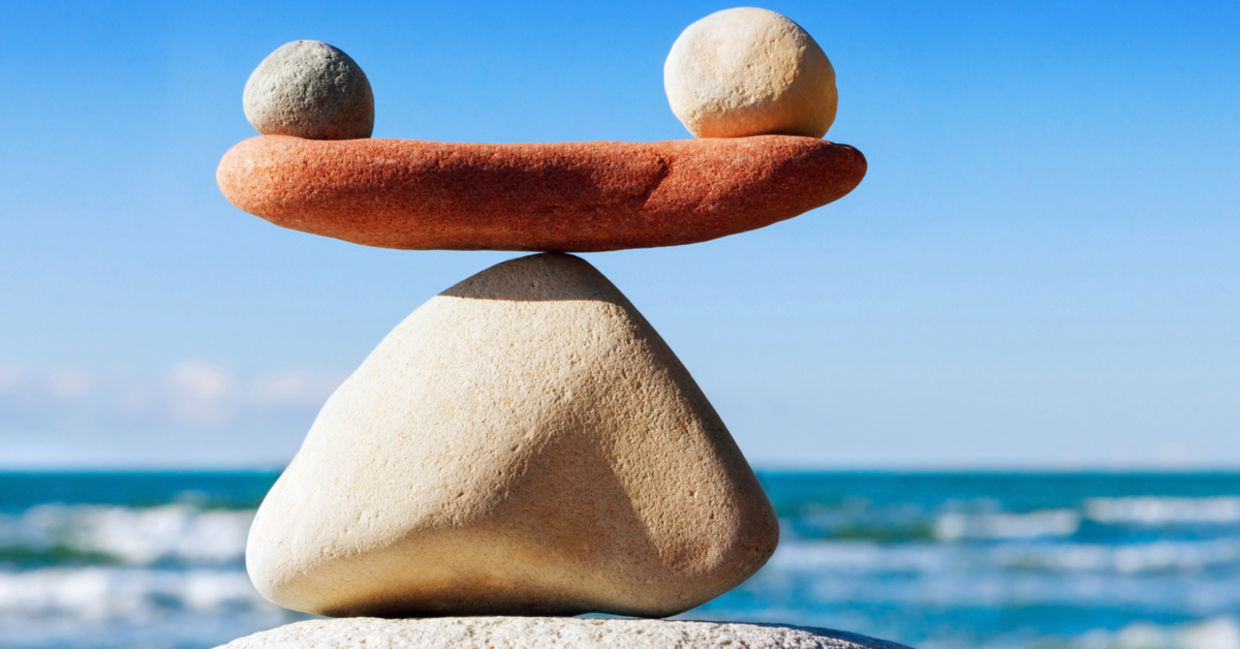 Stones carefully placed one atop another represent clarity and balance.