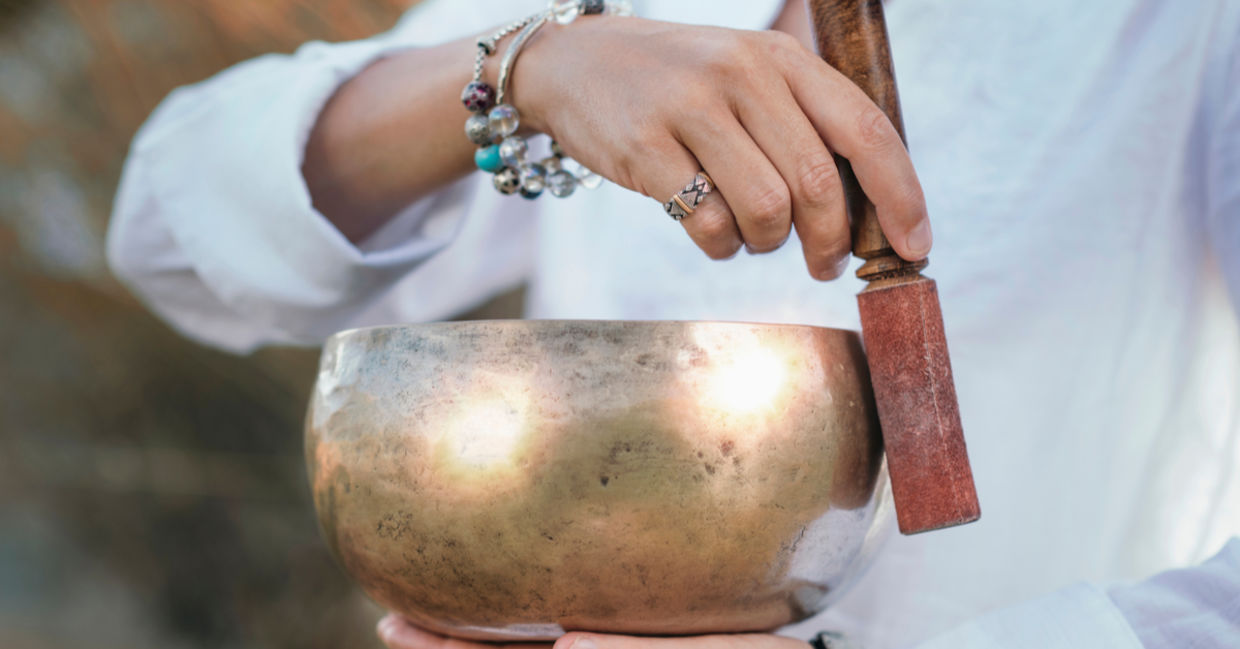 A Tibetan singing bowl is used for sound meditation.