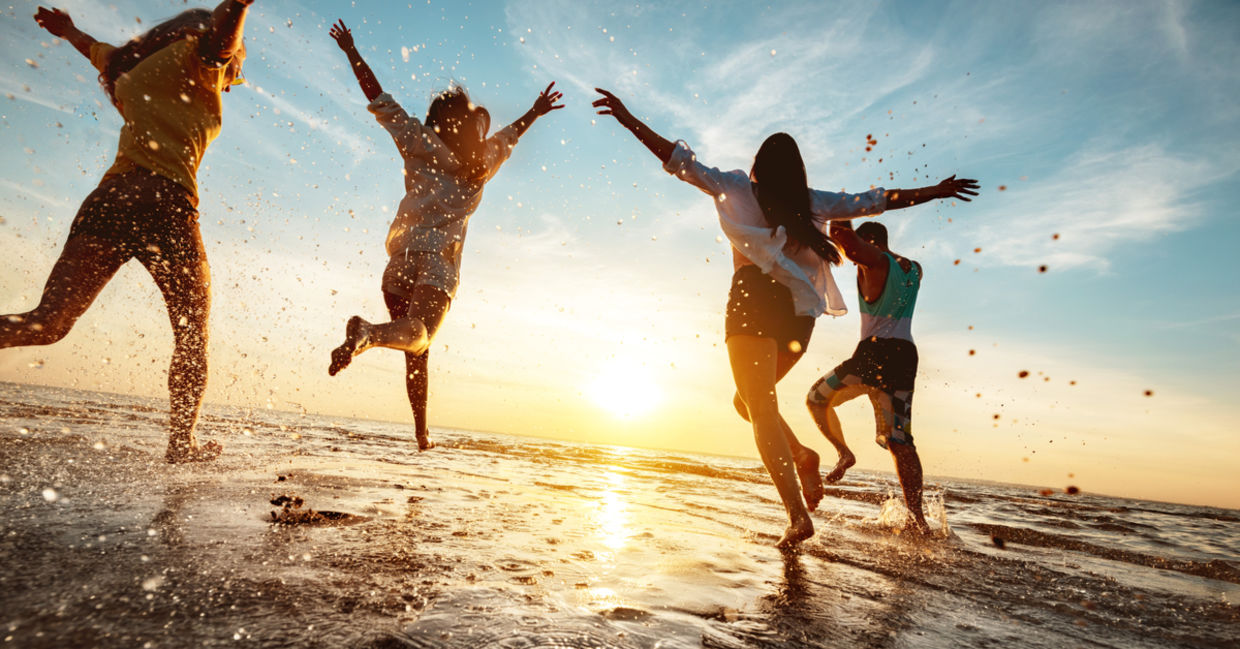 Four happy friends enjoying the beach. Four happy friends enjoying the beach.