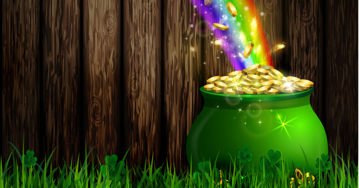 A pot of gold at the end of a rainbow. A pot of gold at the end of a rainbow.