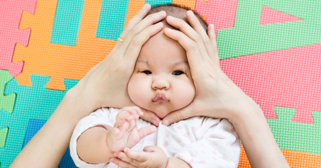 A mother squeezes her cuddly baby, gemes-style. A mother squeezes her cuddly baby, gemes-style.