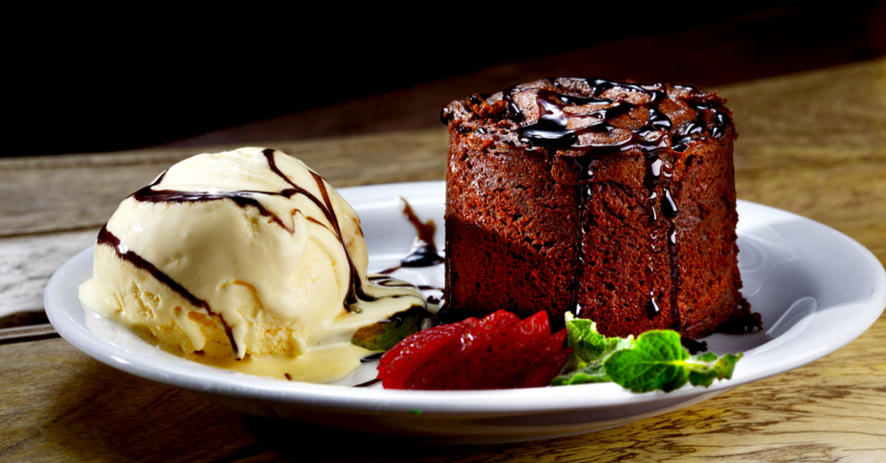 Mouthwatering vanilla ice cream and chocolate cake Mouthwatering vanilla ice cream and chocolate cake