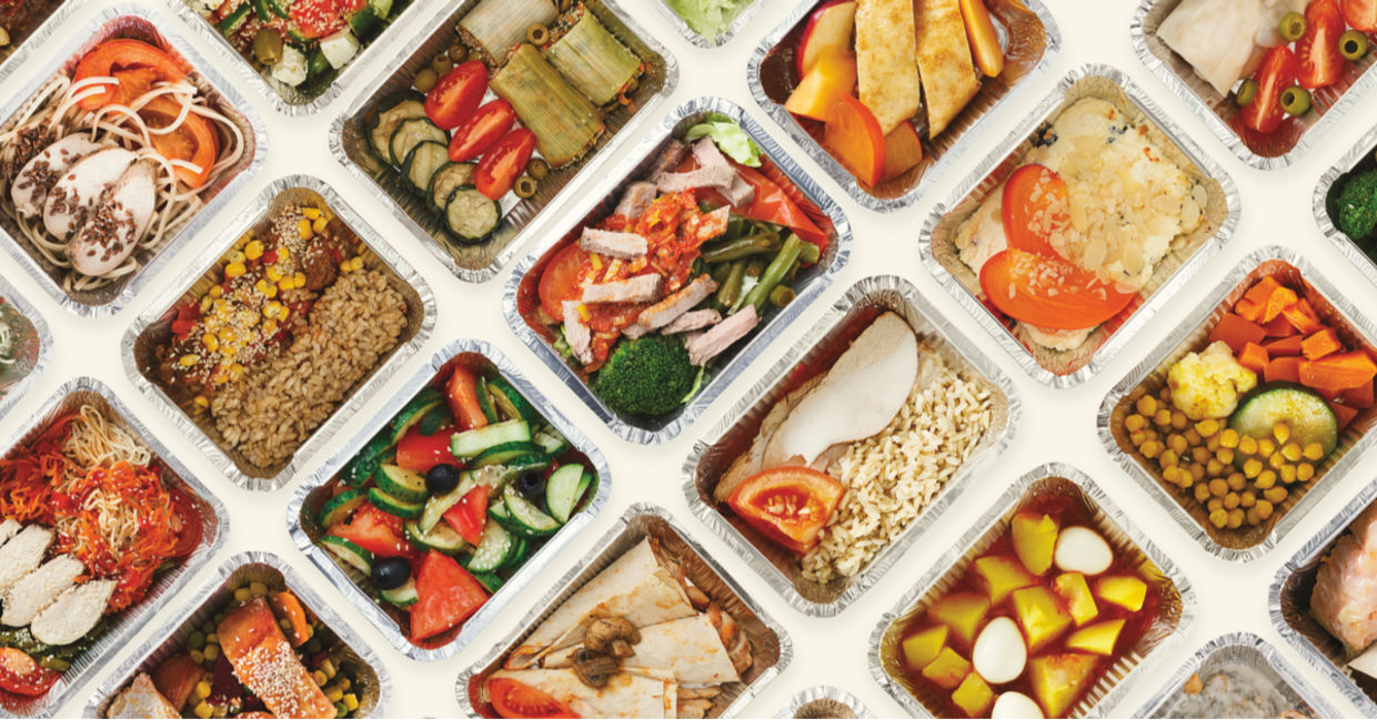 Restaurant food is wrapped in foil tins, ready for doggie bags. Restaurant food is wrapped in foil tins, ready for doggie bags.