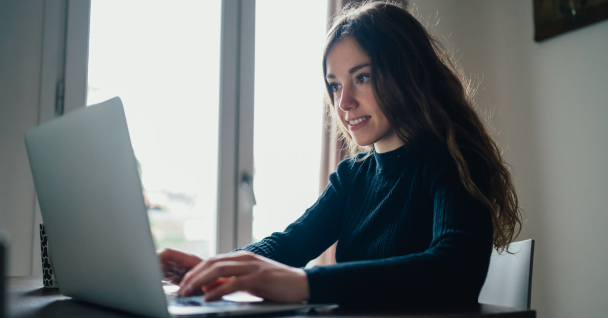 A young woman sitting with her laptop. A young woman sitting with her laptop.
