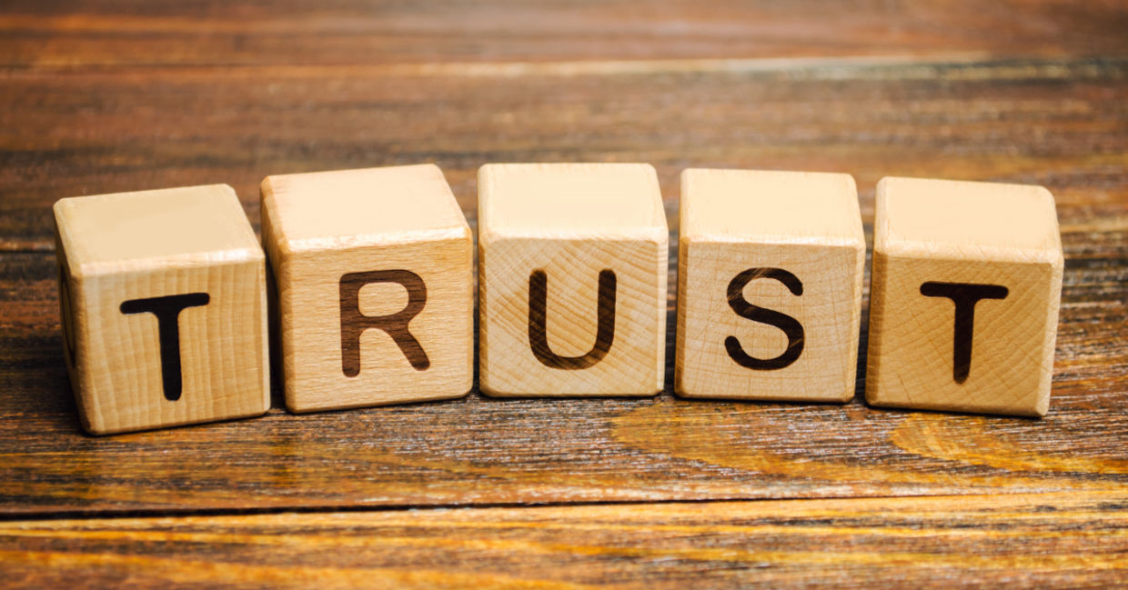 Wooden blocks with the word Trust.