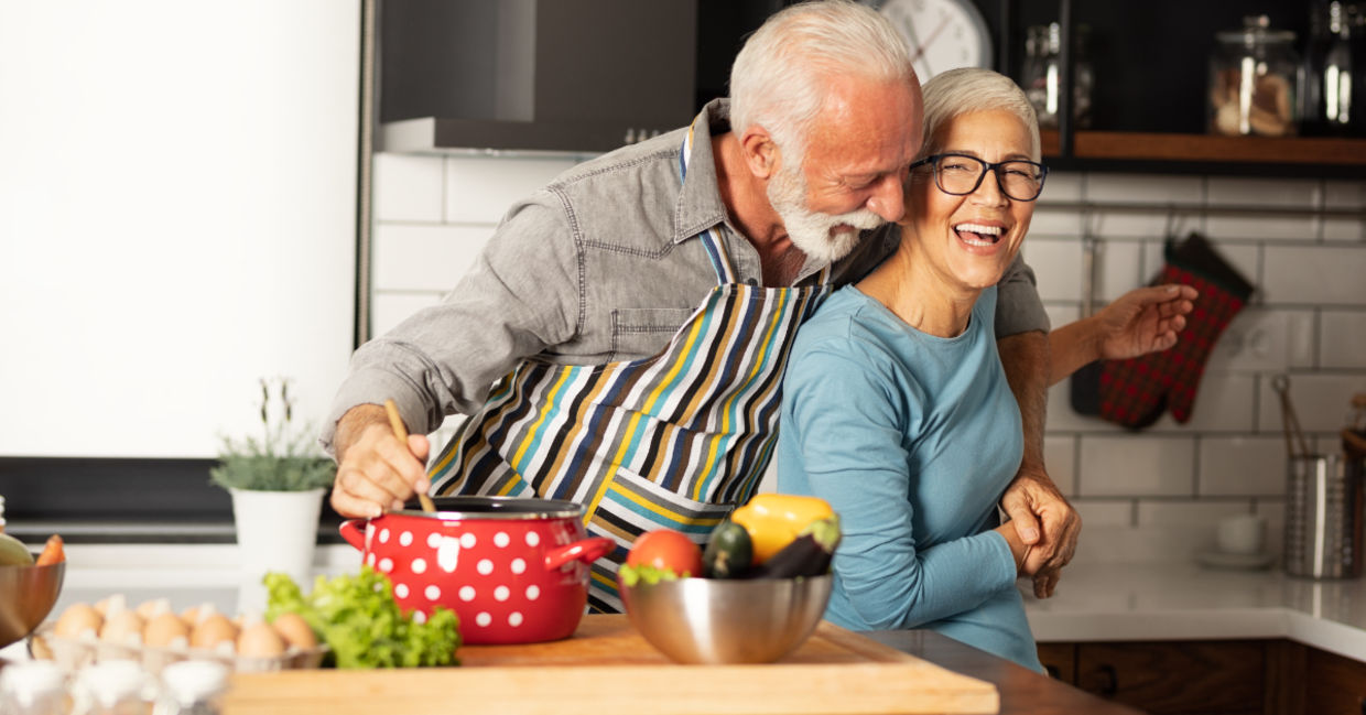 Couple preparing a healthy meal together in the kitchen Couple preparing a healthy meal together in the kitchen