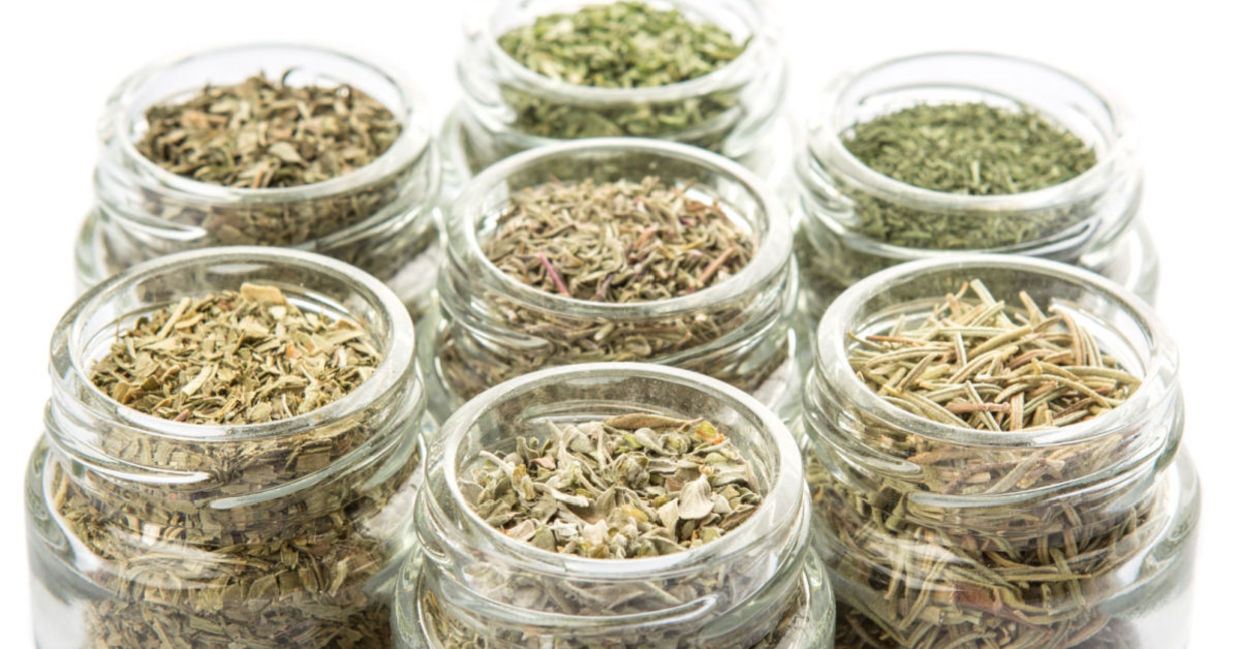 Herbs stored in small jars. Herbs stored in small jars.