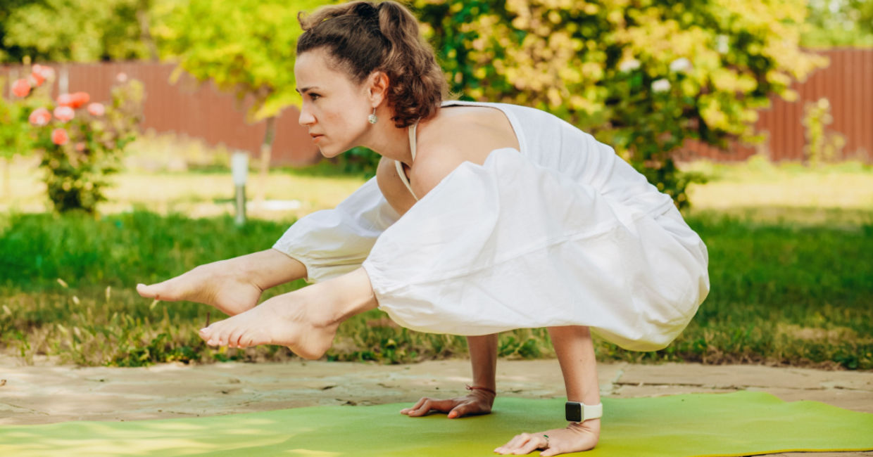 Woman in the firefly yoga pose. Woman in the firefly yoga pose.