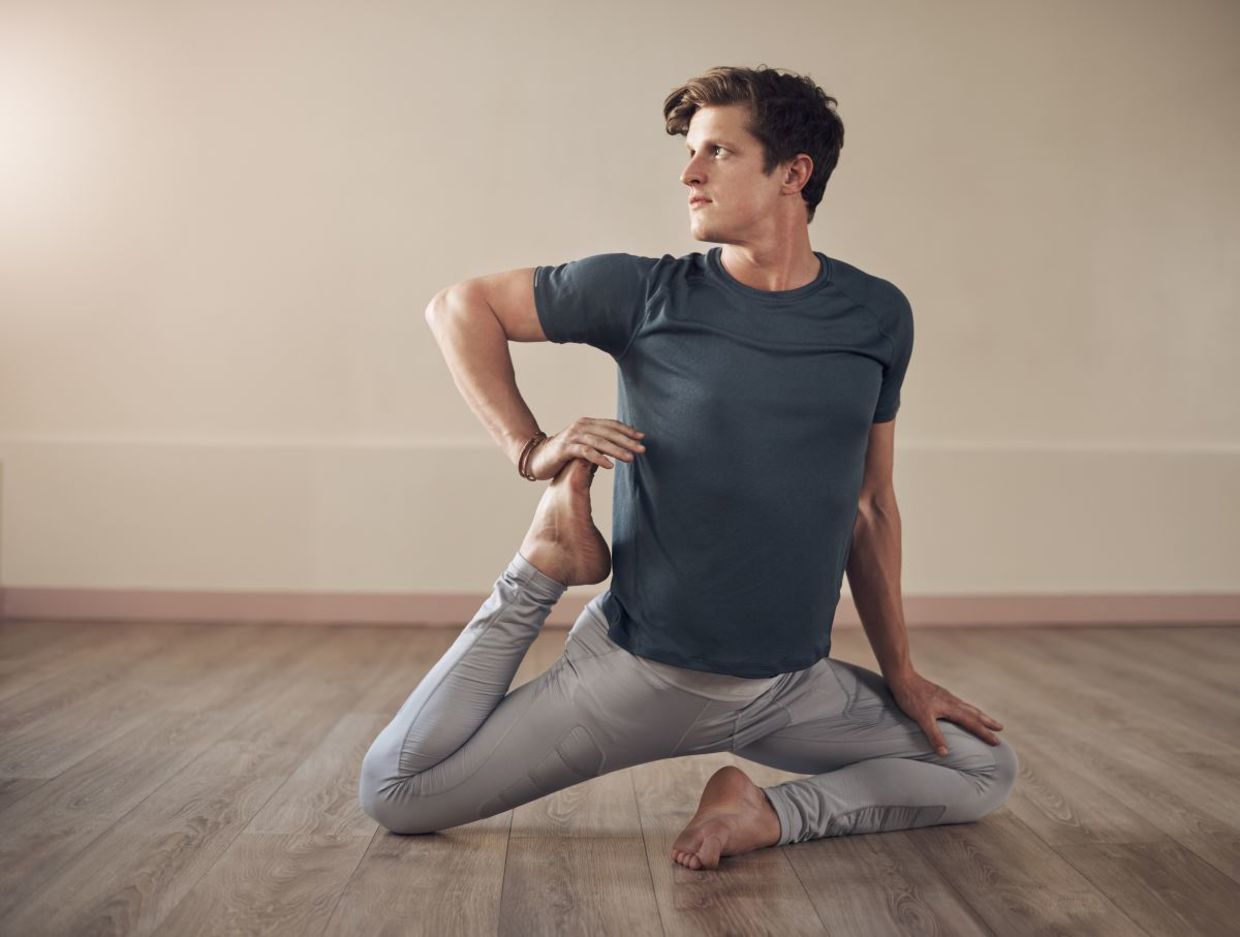 Concentrating in the mermaid yoga pose.