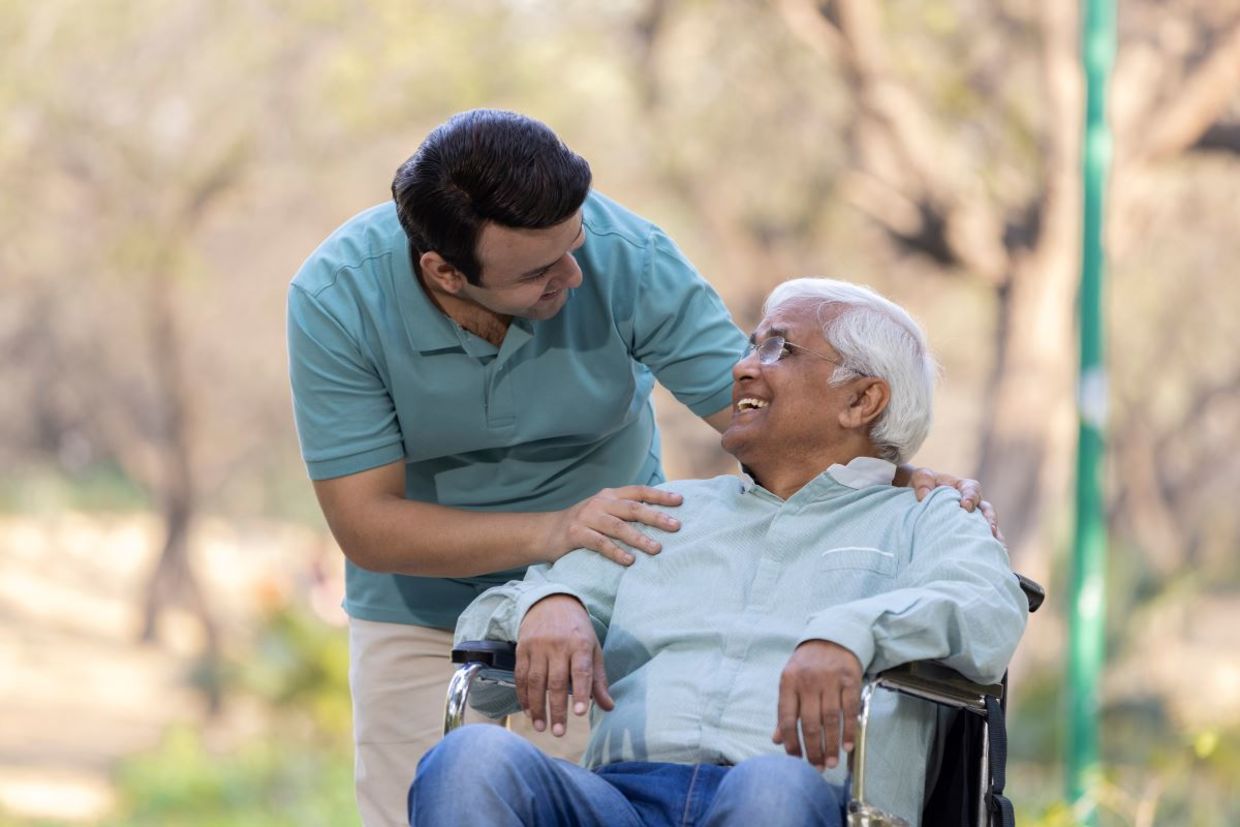 A young man helping a senior. A young man helping a senior.