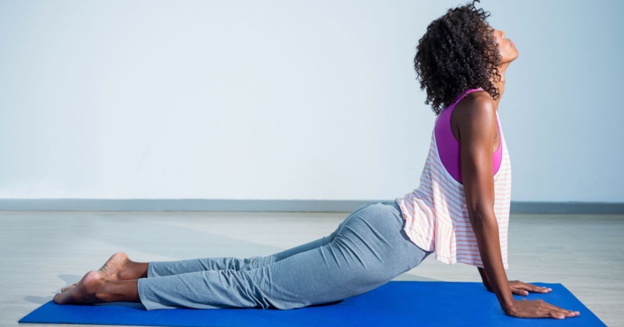 Woman in the cobra pose. Woman in the cobra pose.