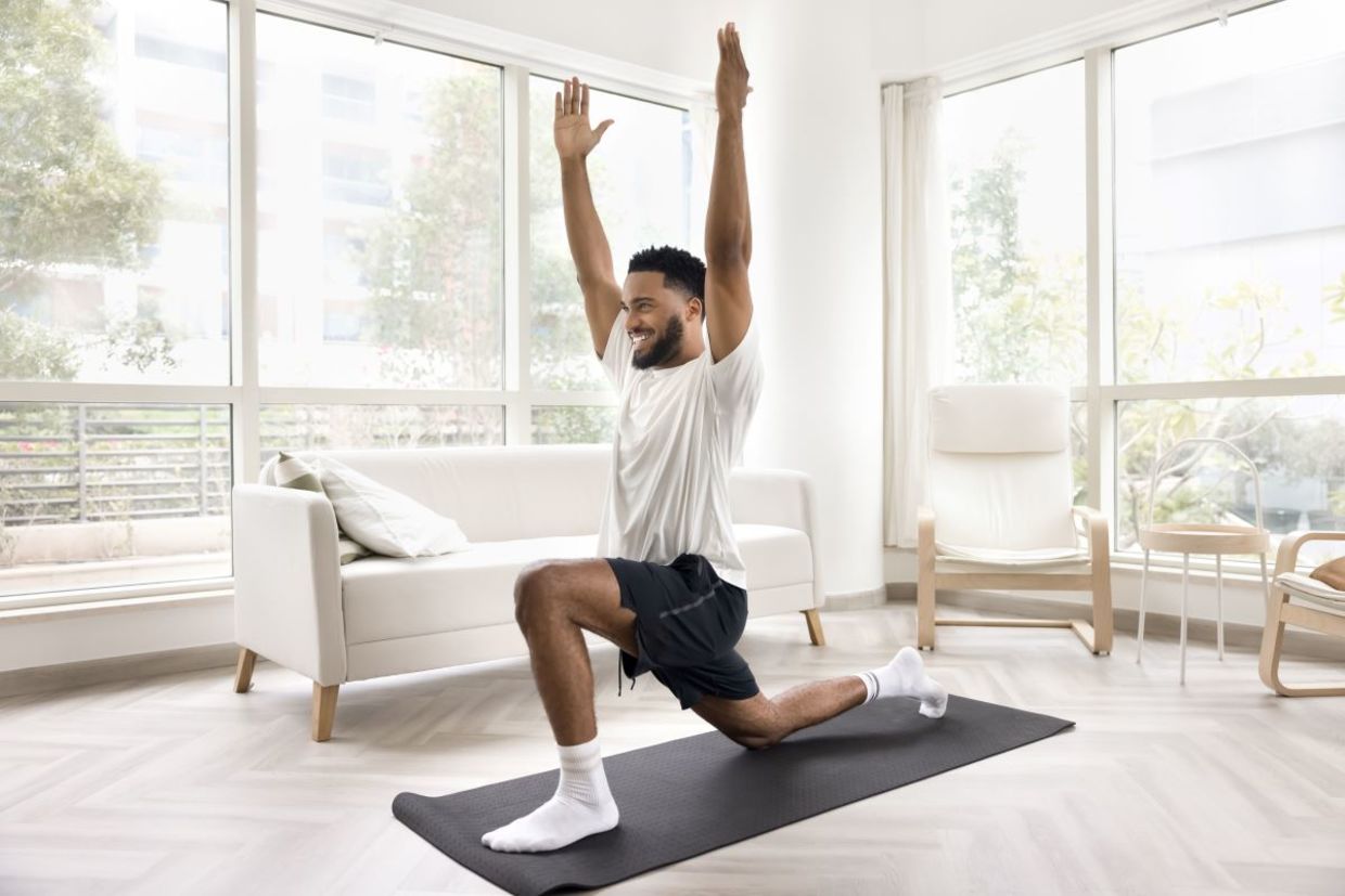 Stretch with the low lunge yoga pose. Stretch with the low lunge yoga pose.