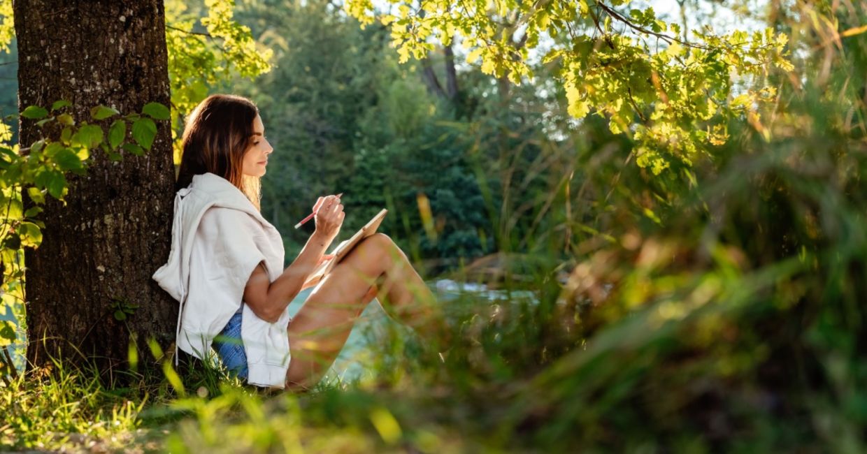 Woman journaling out in nature. Woman journaling out in nature.