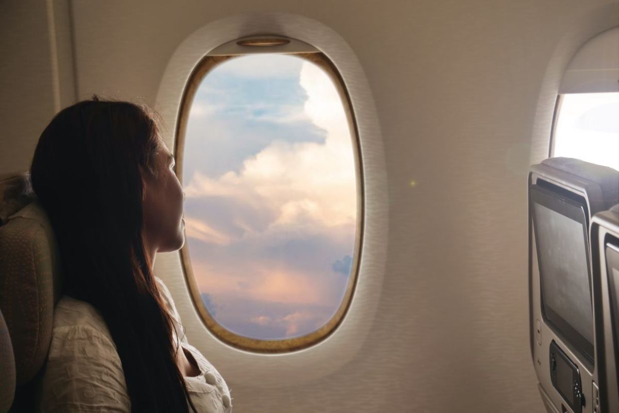 Calm woman on an airplane. Calm woman on an airplane.