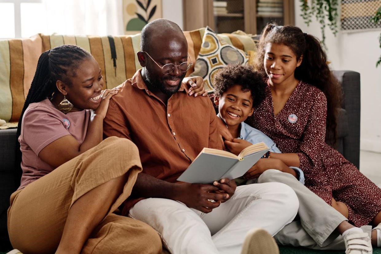 Reading books out loud as a family.