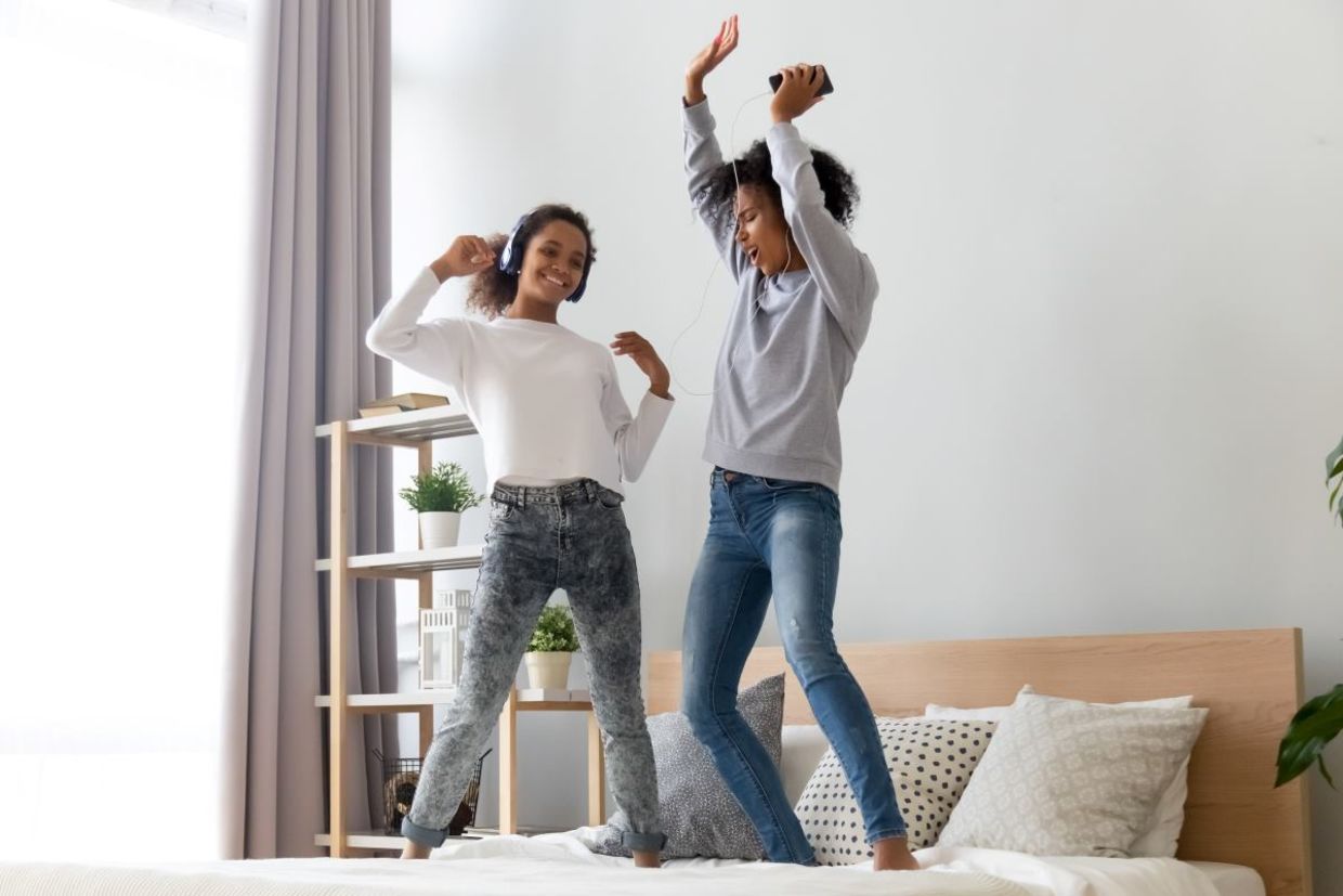 Mother and daughter dancing to golden oldies.