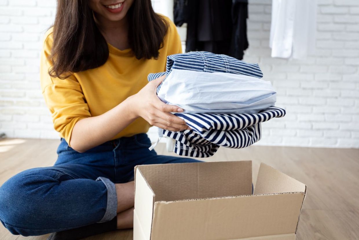 Getting clothing ready to donate. Getting clothing ready to donate.