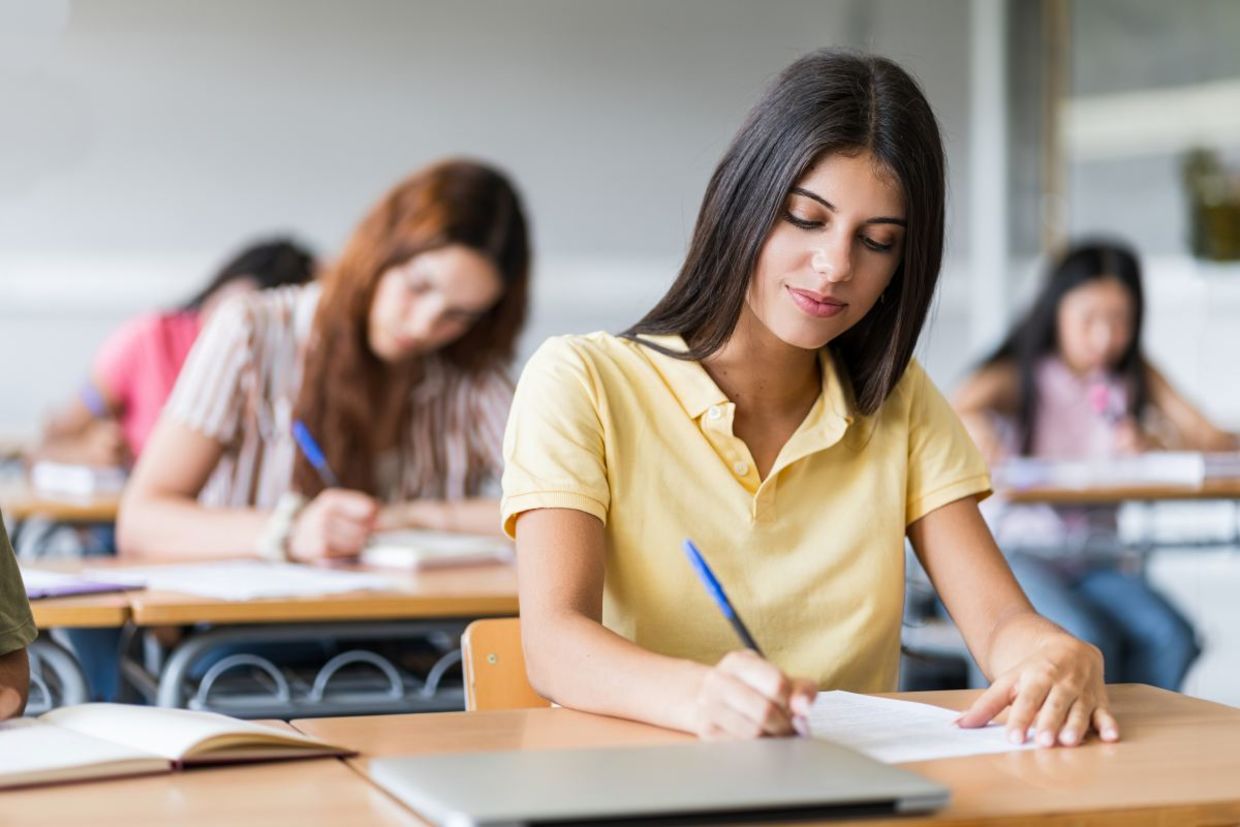 Teens in classroom. Teens in classroom.