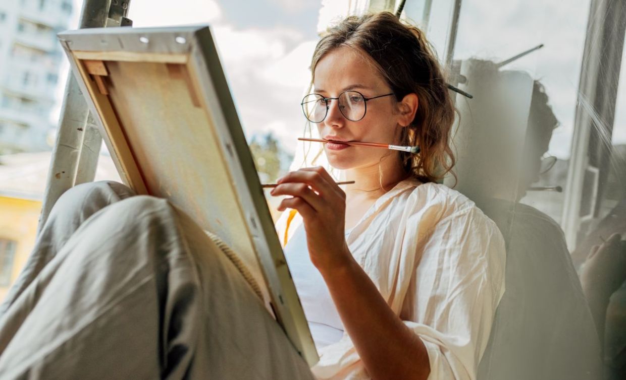 Young mom taking some me time to paint. Young mom taking some me time to paint.