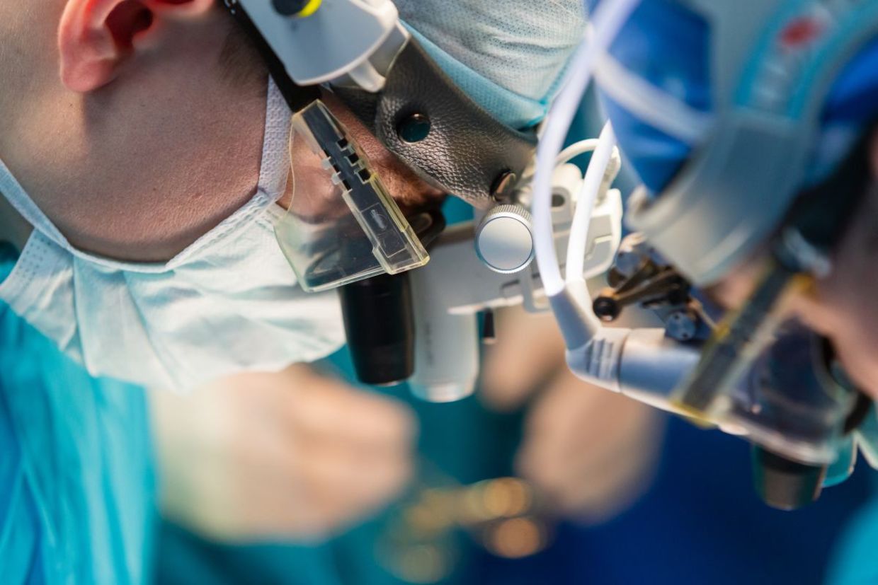 Surgeons doing a kidney transplant. Surgeons doing a kidney transplant.