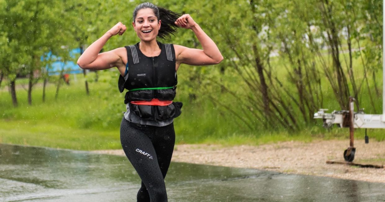 Woman walking with a weighted vest. Woman walking with a weighted vest.