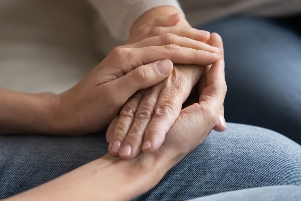Two people hold hands. Two people hold hands.